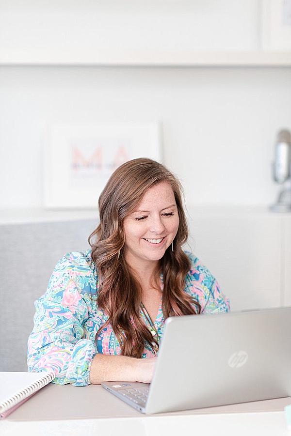 a headshot of Melissa Arlena owner of Picture Perfect Rankings siting at her laptop working on her follow up system