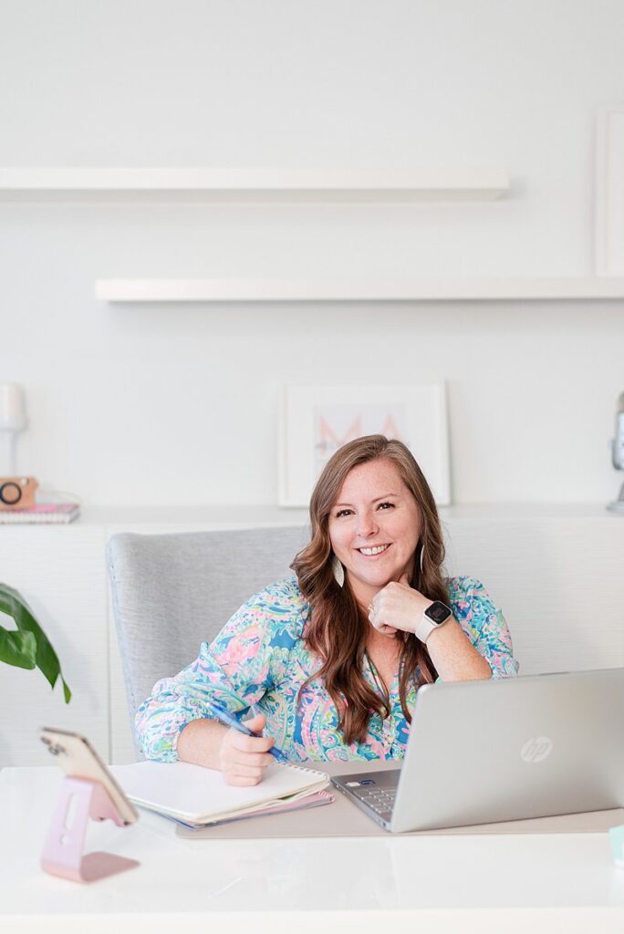 a headshot of Melissa Arlena owner of Picture Perfect Rankings sitting at her desk