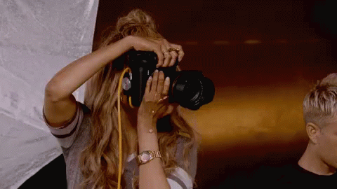 gif of photographer taking photos to document everything during your scouting trip